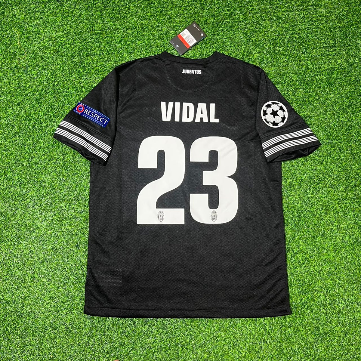 Black soccer jersey with 'VIDAL 23' on a green grass background