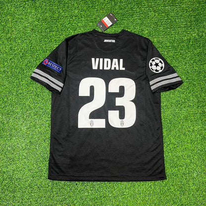 Black soccer jersey with 'VIDAL 23' on a green grass background