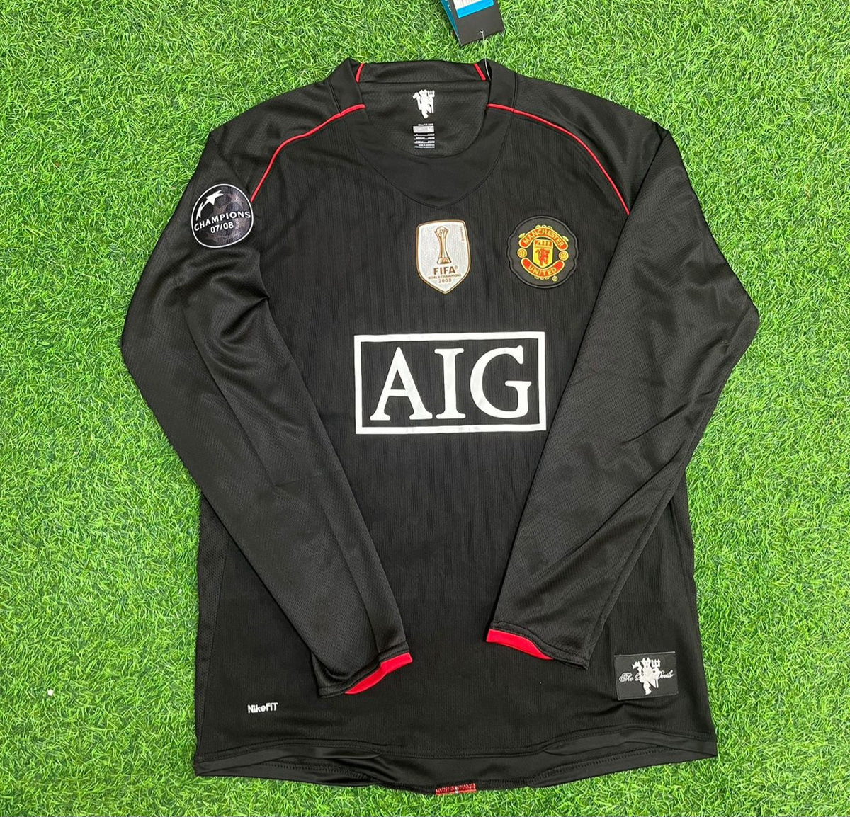 Maillot de football rétro noir Manchester United 2007/2008 avec écusson de la Ligue des champions